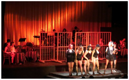 (Image: The Cabaret Girls Dance with Rolling
  Prison Bars)