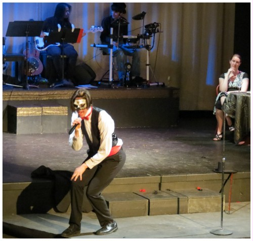 (Image: CEE Partially Crouches as he Performs
  a Solo Number on the Thrust Stage)
