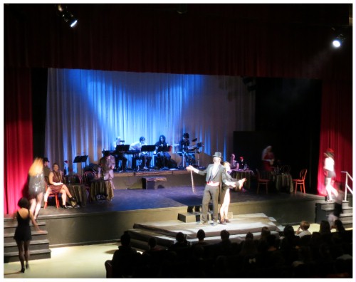 (Image: CEE and Mama Perform on the Thrust Stage,
  while the Girls Return to the Main Stage)