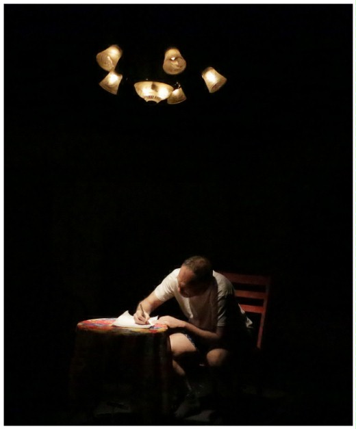 (Image: Robert Writes out a Confession
 Seated at a Table by Himself)