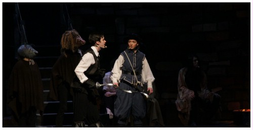 (Image: Quixote and Sancho Confer
  in front of their Horse and Mule)