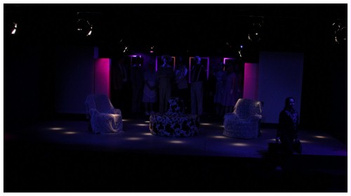 (Image: Mona Leaves the House as the
   Cast Looks on from the Shadows)