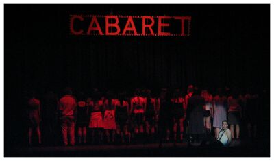 (Image: The Sign begins to go out as Life continues in Berlin)