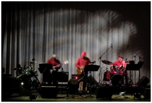 (Image: The Band in a Quiet Song with Wisps Behind)