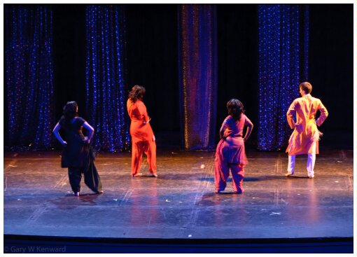 (Image: Dancers in Indian-Style Dress Perform in a Colourful
  Scene)
