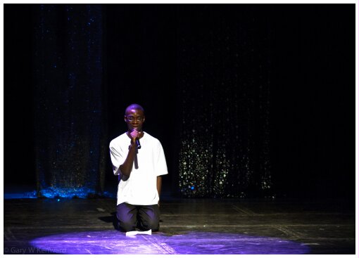 (Image: A Single Performer Kneels at a Pool of Lavender)