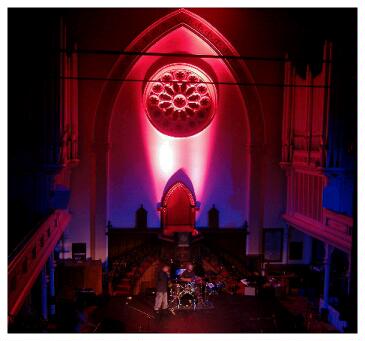 (Image: The Stage with Pink Slashes on the Rear Wall)