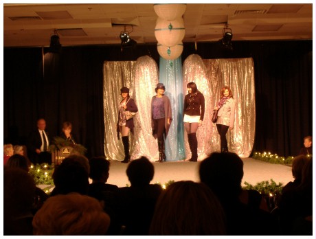 (Image: Models Pose in Front of the Runway Entry)