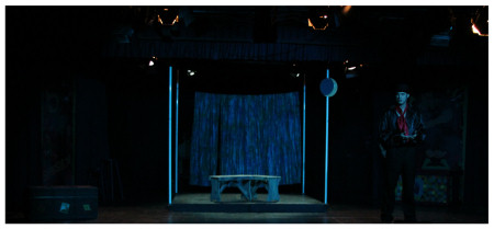 (Image: The `Moonlight' Set with one Actor Dimly
 Lit)