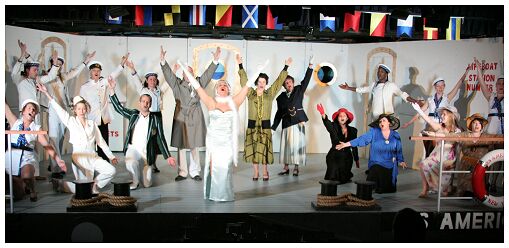 (Image: The Entire Cast with Arms Raised)