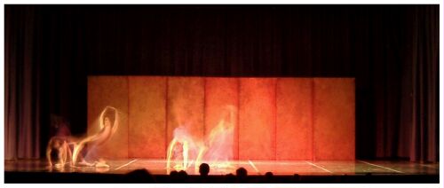 (Image: Dancers in Front of Orange-Coloured Rear Flats)