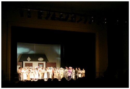 (Image: Long Shot of the Stage with
the Majority of the Cast)