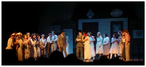 (Image: The Music Man speaks with the Mayor
and his Wife)