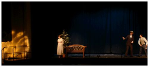 (Image: The Librarian waits while the Music
  Man confers with an Accomplice)