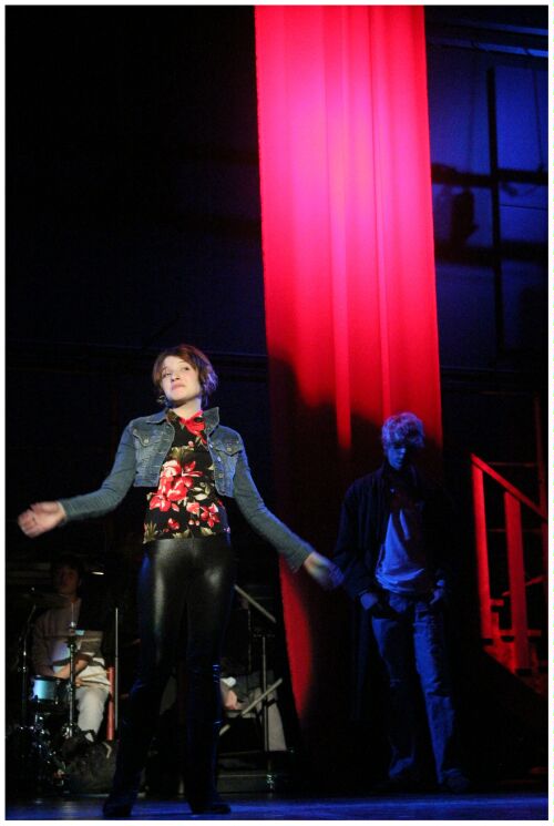 (Image: A Closeup of Actors Near the Flag)