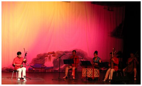 (Image: A Traditional Chinese Band Performs
  with a Soloist Musician)