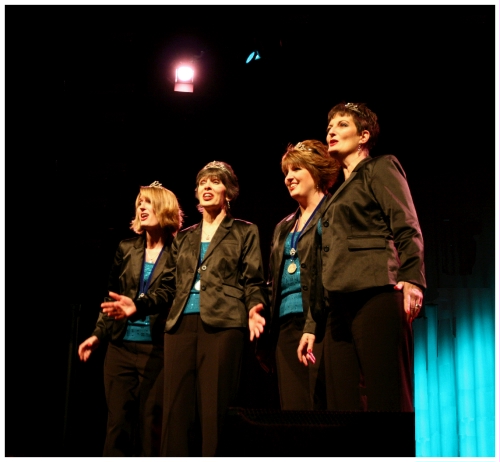 (Image: Closeup of Four Female Barbershoppers
Performing)