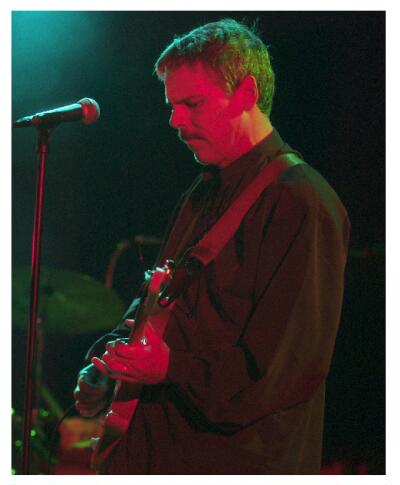 (Image: Closeup of `Time Bandits' Stage Left Guitar Player)