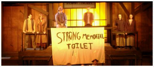 (Image: Upper Stage Area with `Memorial Toilet' Banner)