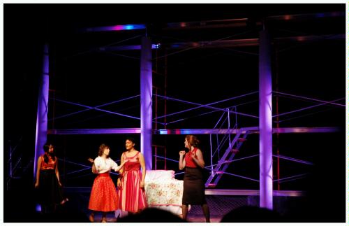 (Image: Maria and Friends talk in her Bedroom)