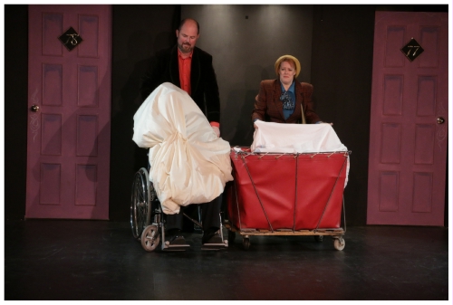 (Image: Harry and Annabel Attempt to Hide
  Themselves and Tony by using the hotel sheets
  and laundry Hamper)