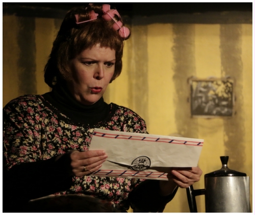 (Image: The Landlady Wonders about the contents
  of a Telegram that She is Holding