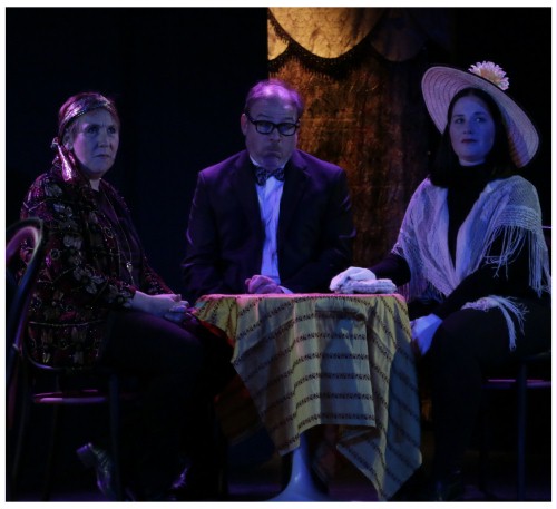 (Image: Three Patrons of the Night Club
  Watch the Show from a Back Table)